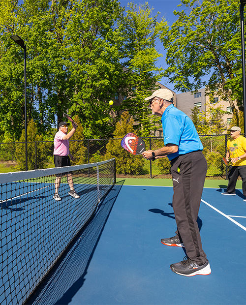 seniors playing pickleball